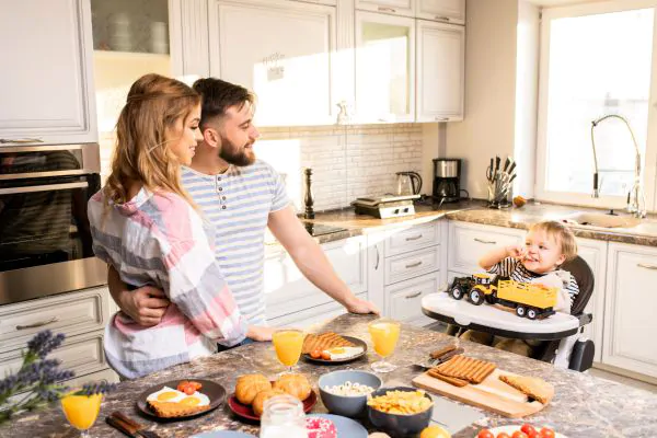 Happy Young Family in Kitchen