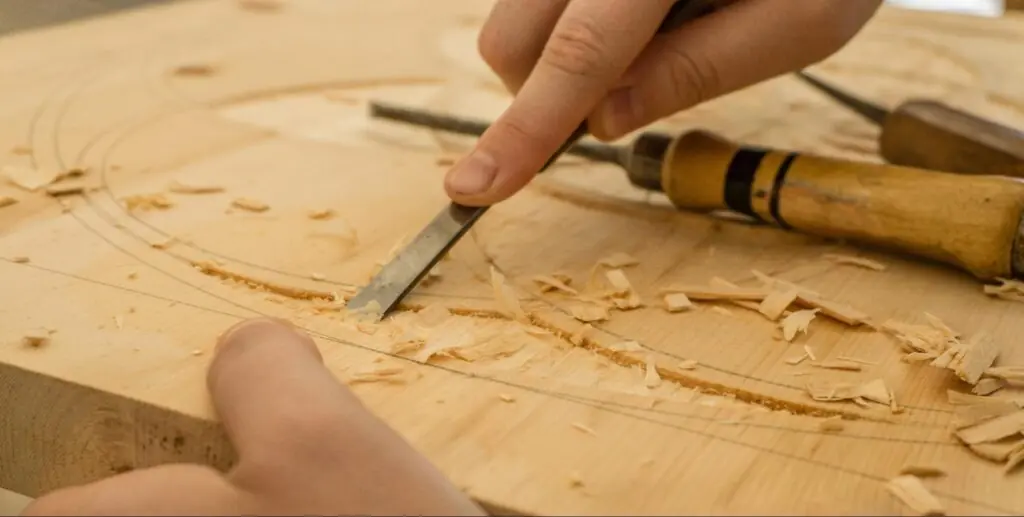 custom cabinet maker carving on wood