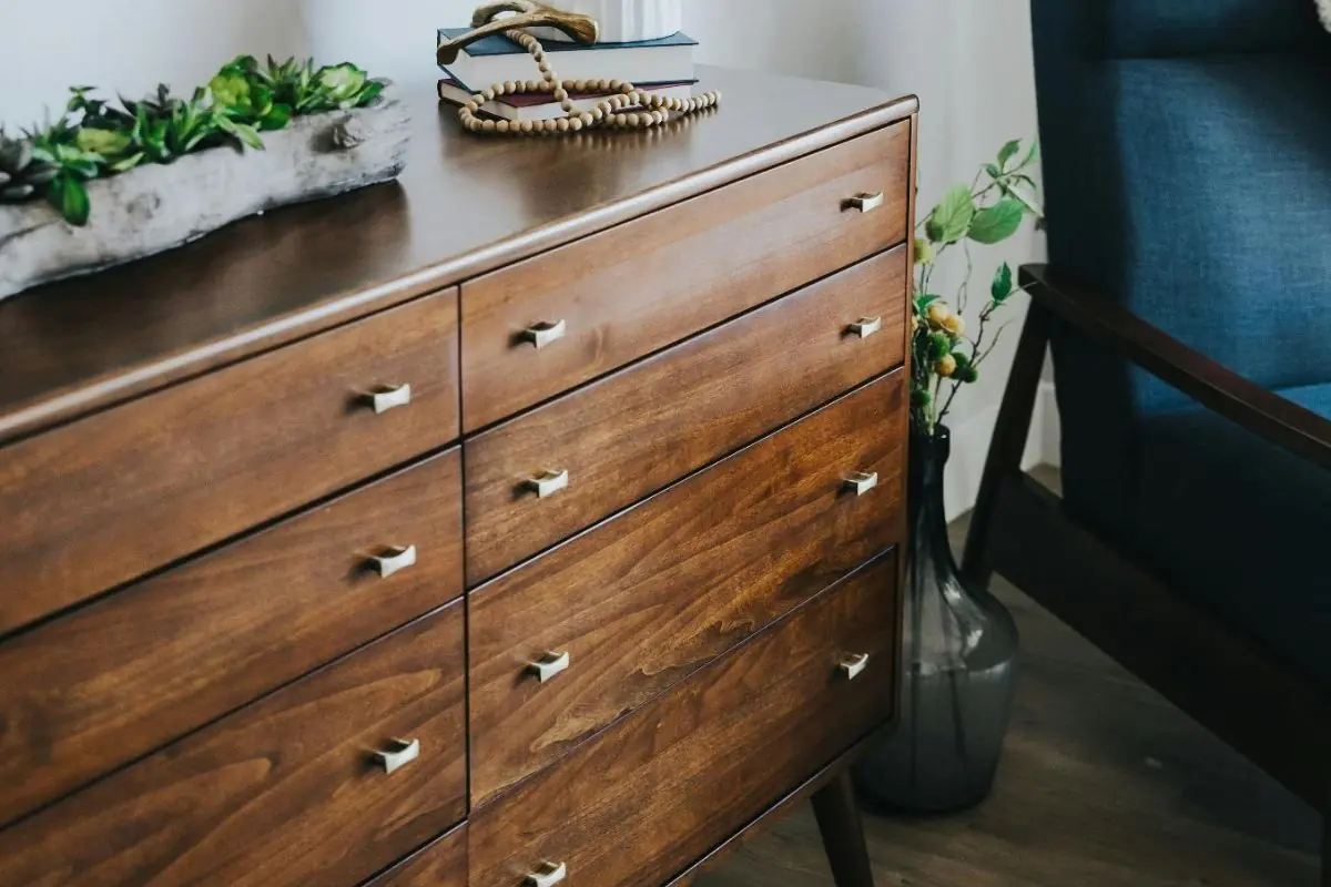 dark wood living room storage cabinet with stainless knobs