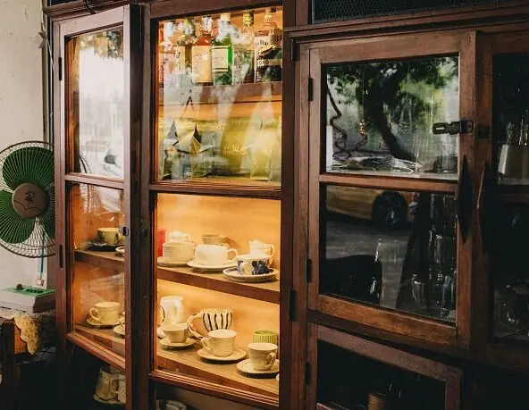 traditional style display cabinet for antique cups and utensils