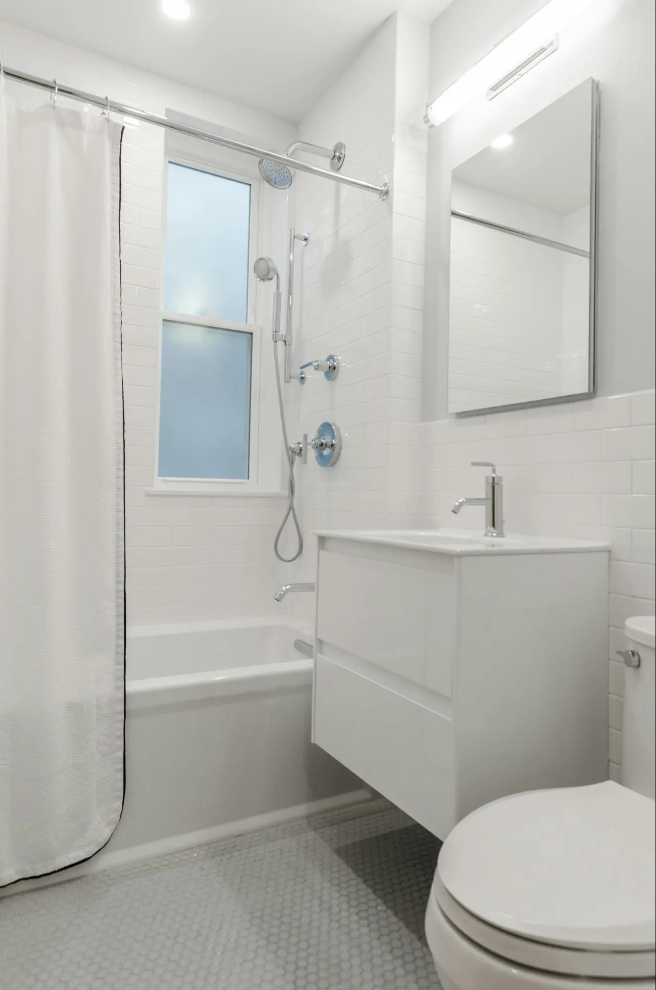 all white minimalistic bathroom design in beacon hill ma