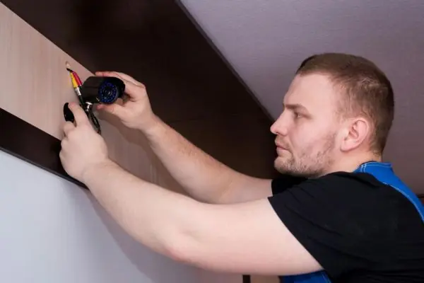 cabinet maker measuring space for installation