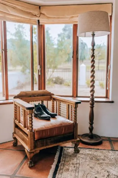 intricate design wood chair and standing lamp