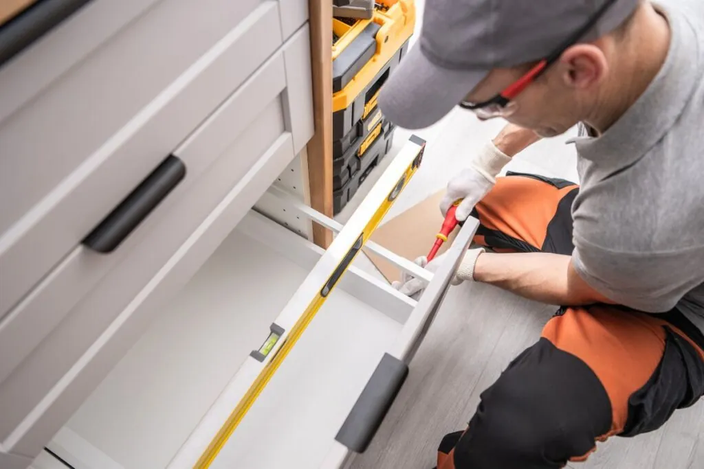 cabinetmaker contractor installing kitchen cabinets